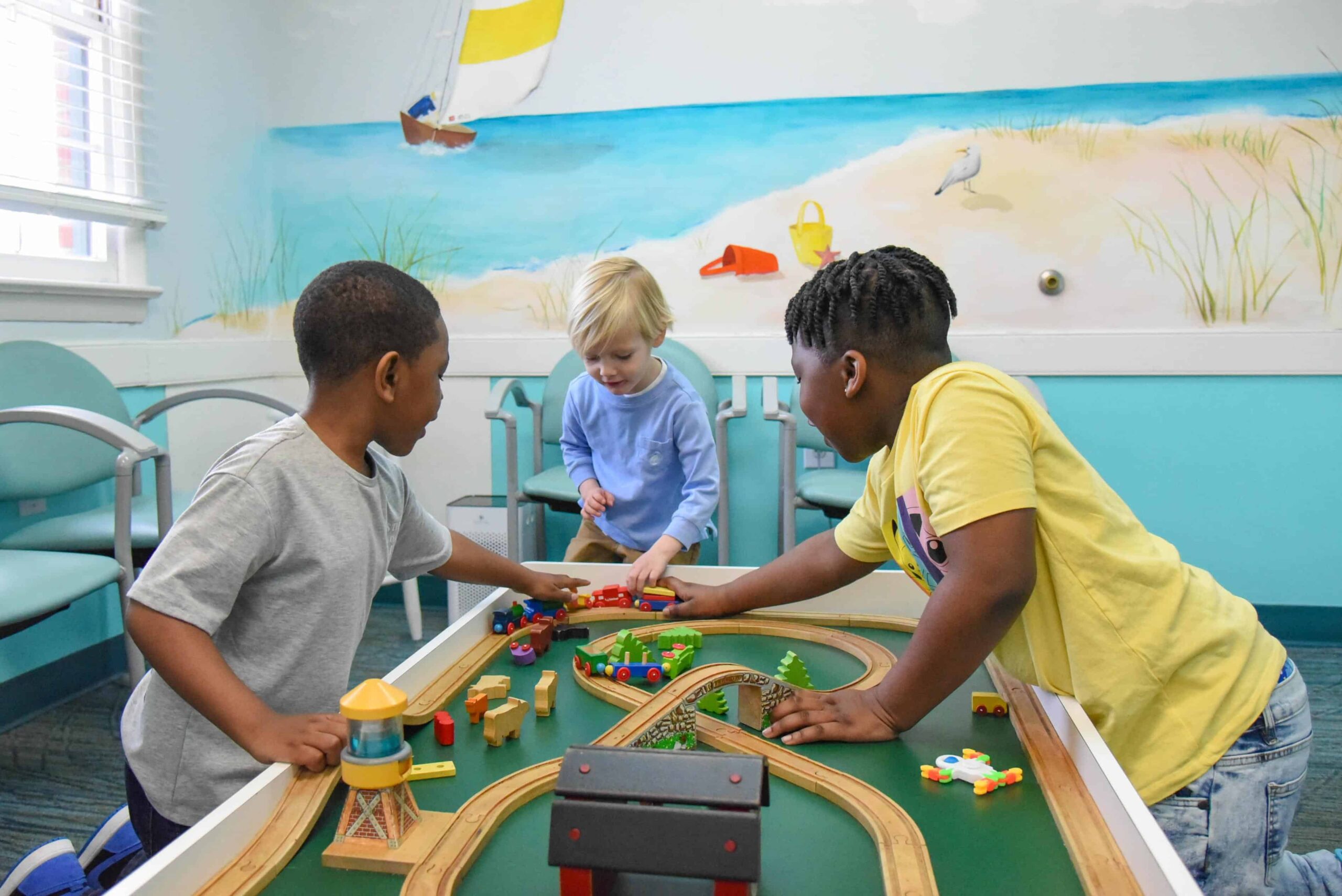 Beach-kids-dentistry-boys-playing-with-trains Boys at pediatric dentist office